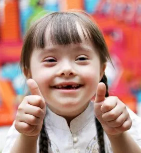 Photo of beautiful happy girl giving a thumbs up