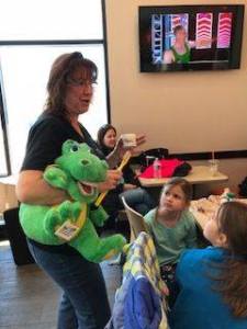 Holly speaking to a Daisy Troop about dental care Saturday morning at Dunkin' Donuts